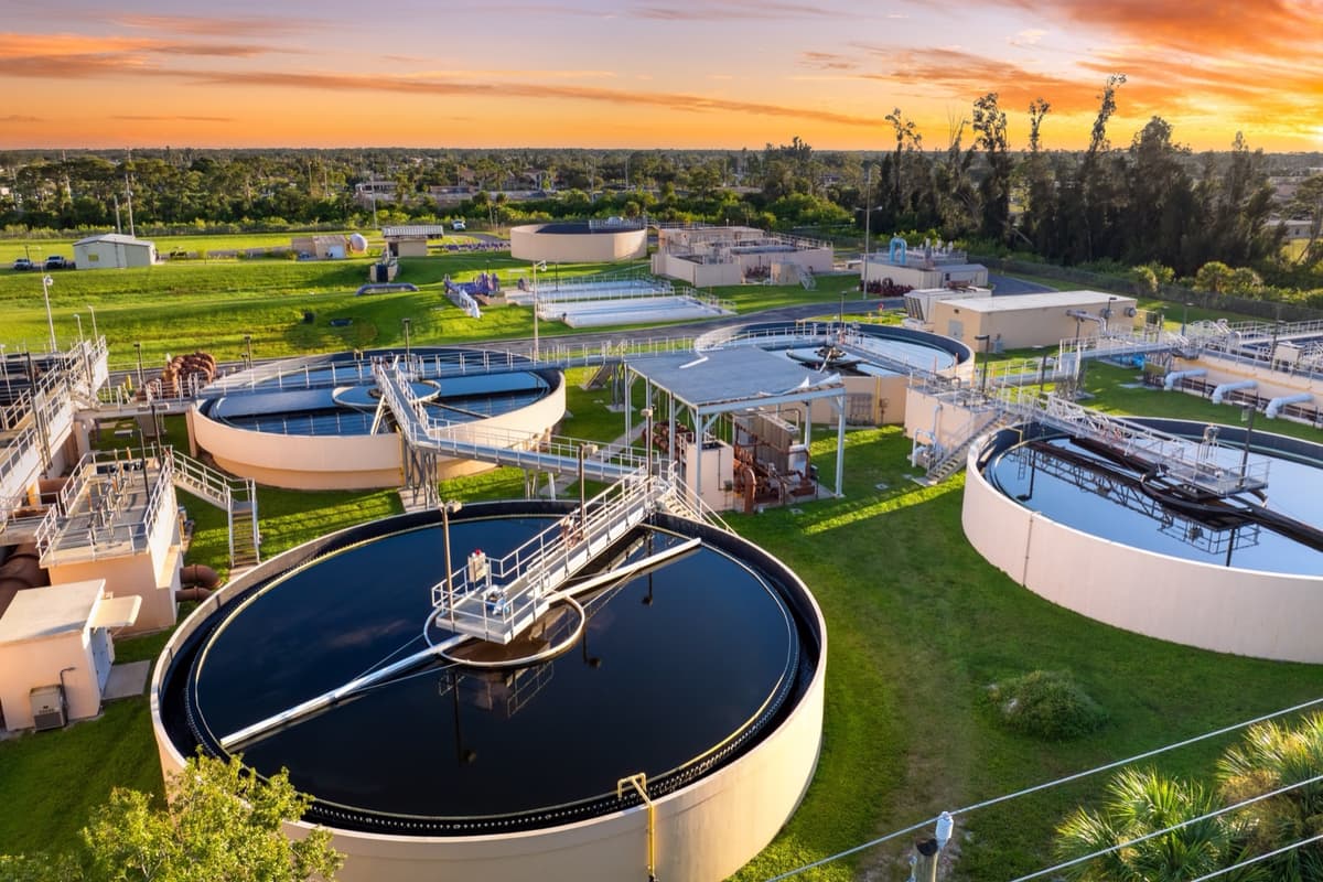 Water treatment plant worker inspecting facility